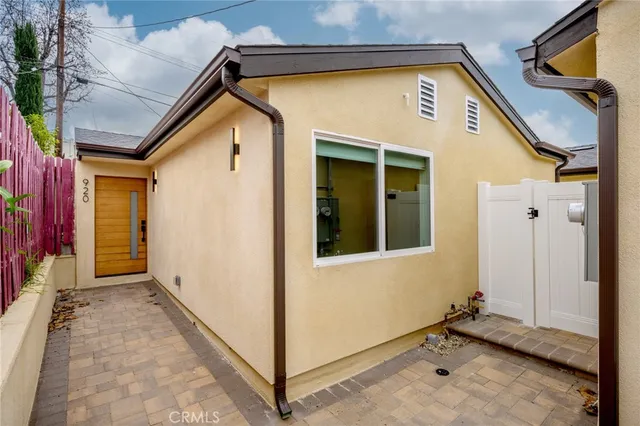 a view of a wooden door with a wooden fence