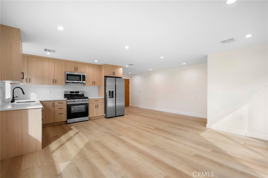 920 University Burbank, CA 91504 - Photo 6 of 20 a kitchen with stainless steel appliances a refrigerator sink and stove
