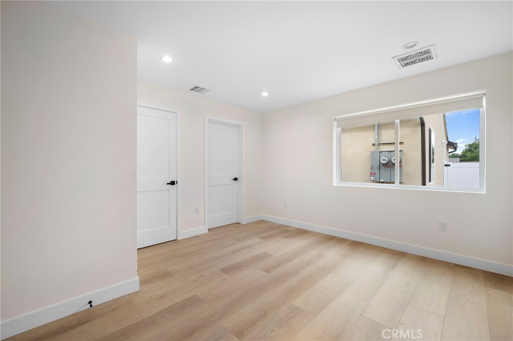 920 University Burbank, CA 91504 - Photo 10 of 20 wooden floor in an empty room with a window