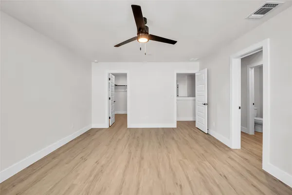 wooden floor in an empty room and a window