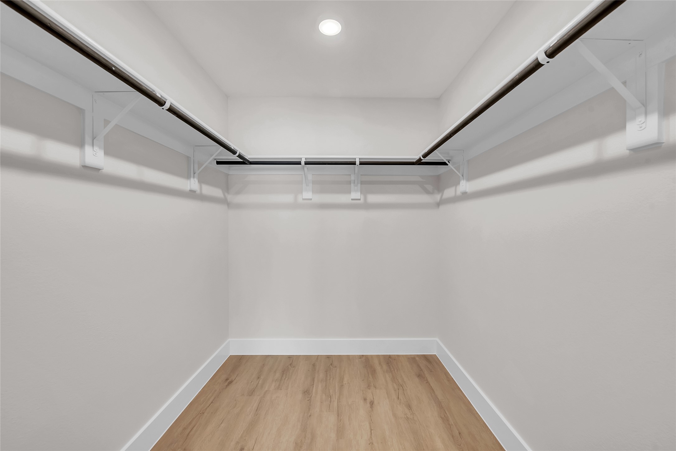 9312 Curious Squirrel Street Austin, TX 78744 - Photo 14 of 22 a view of a room with racks on the wall