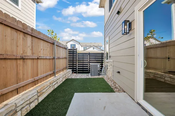 a kitchen with stainless steel appliances granite countertop a sink a stove and a wooden floors