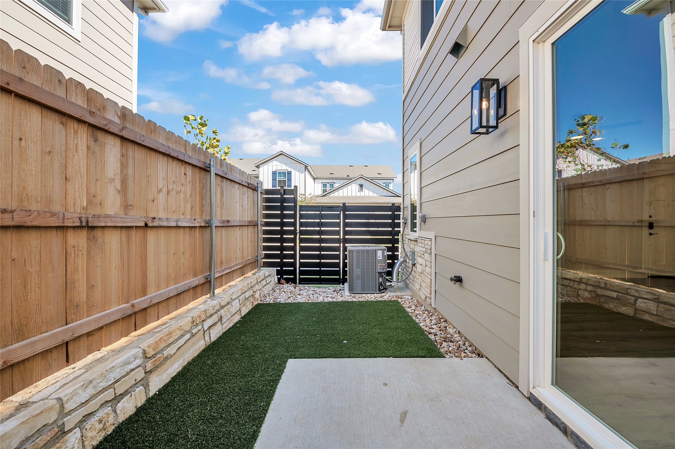 9312 Curious Squirrel Street Austin, TX 78744 - Photo 5 of 22 a view of a back yard of the house