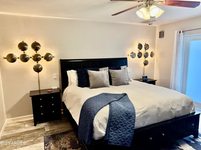 a bathroom with double vanity and a mirror