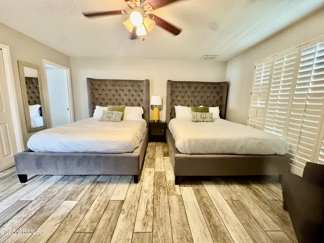 a bedroom with double bed and a window