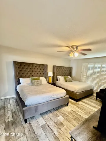 a large bathroom with a double vanity sink and a mirror