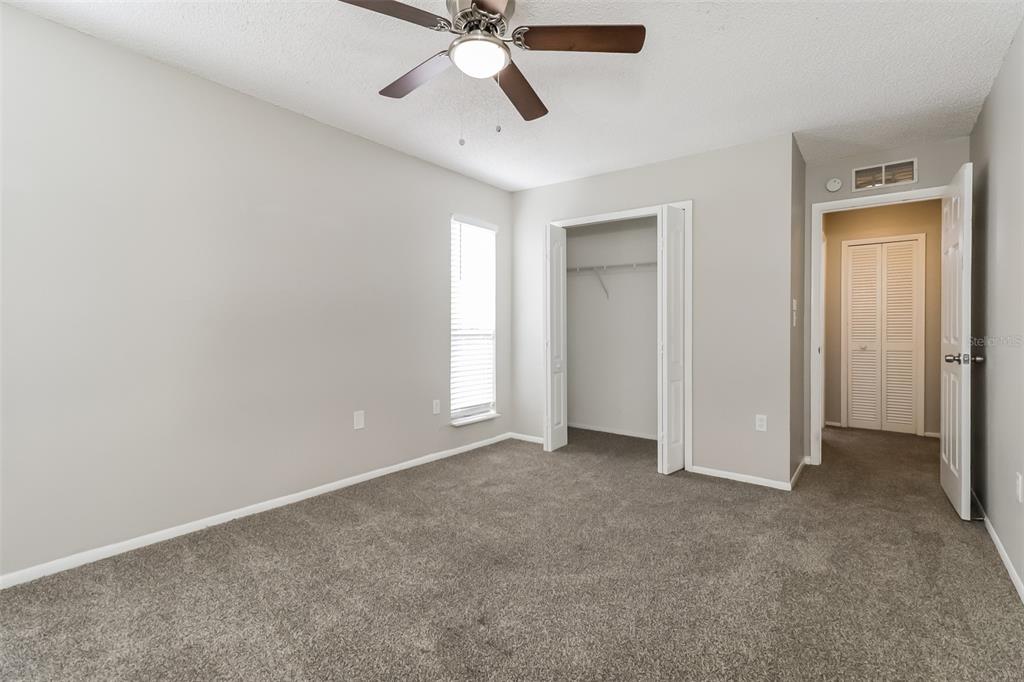 12125 Shadow Ridge Boulevard Hudson, FL 34669 - Photo 11 of 21 an empty room with chandelier fan