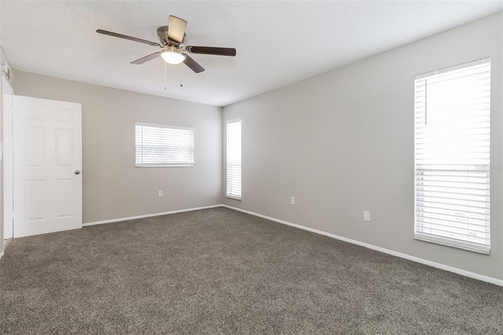 12125 Shadow Ridge Boulevard Hudson, FL 34669 - Photo 15 of 21 a view of an empty room with a window