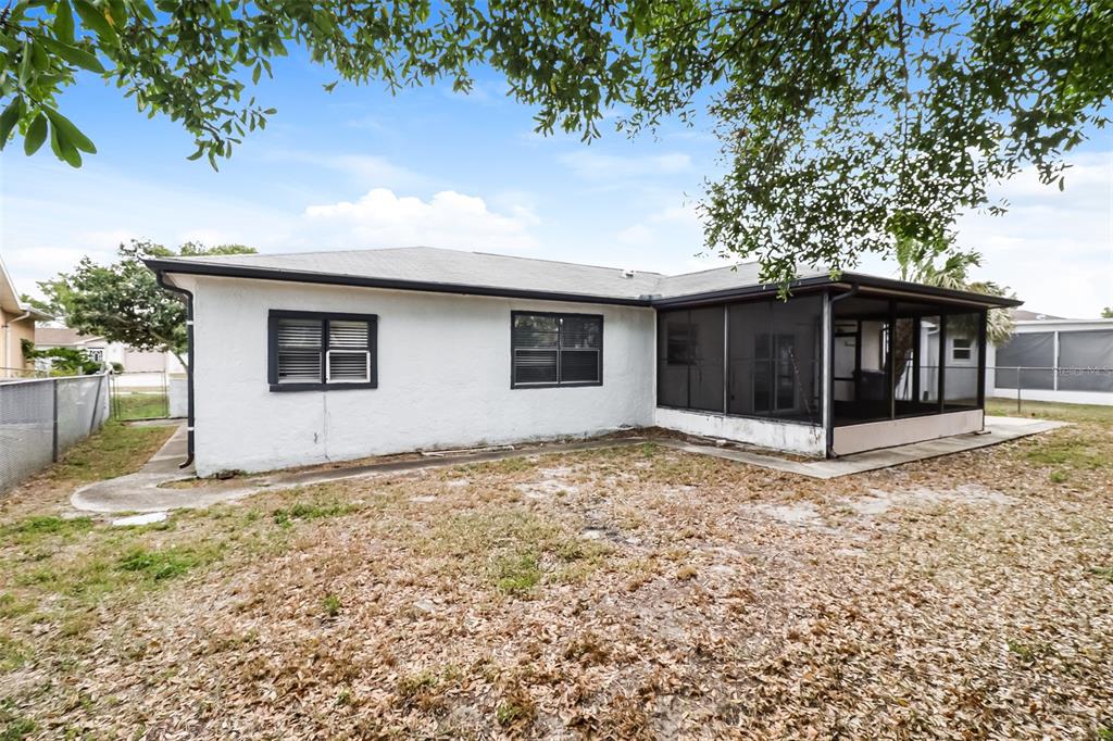 12125 Shadow Ridge Boulevard Hudson, FL 34669 - Photo 19 of 21 a view of a house with a yard