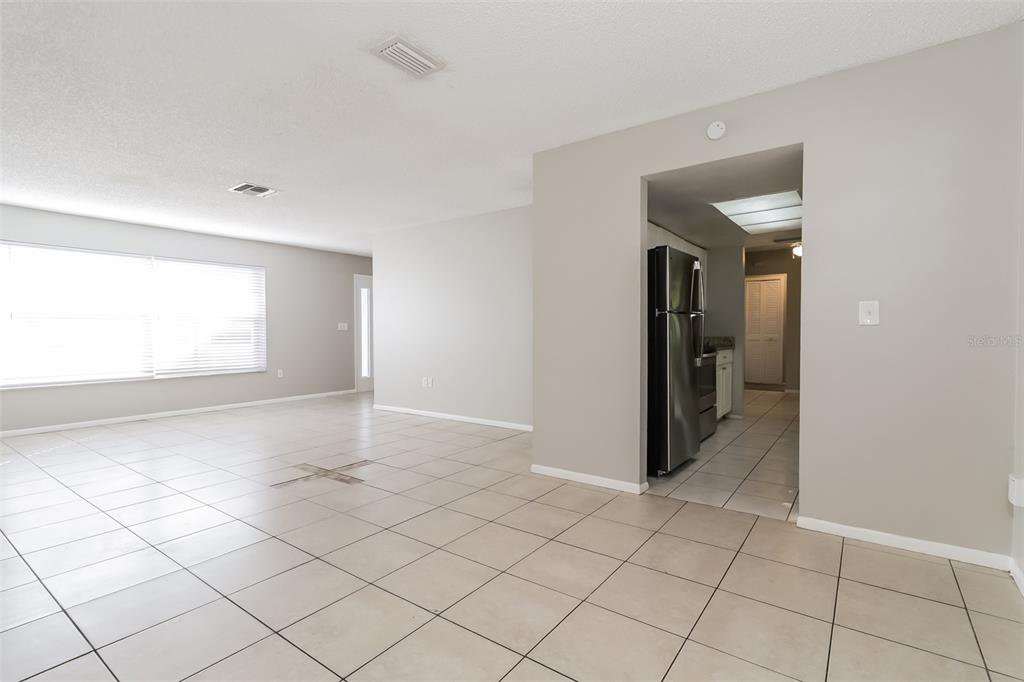 12125 Shadow Ridge Boulevard Hudson, FL 34669 - Photo 5 of 21 a view of an empty room and window