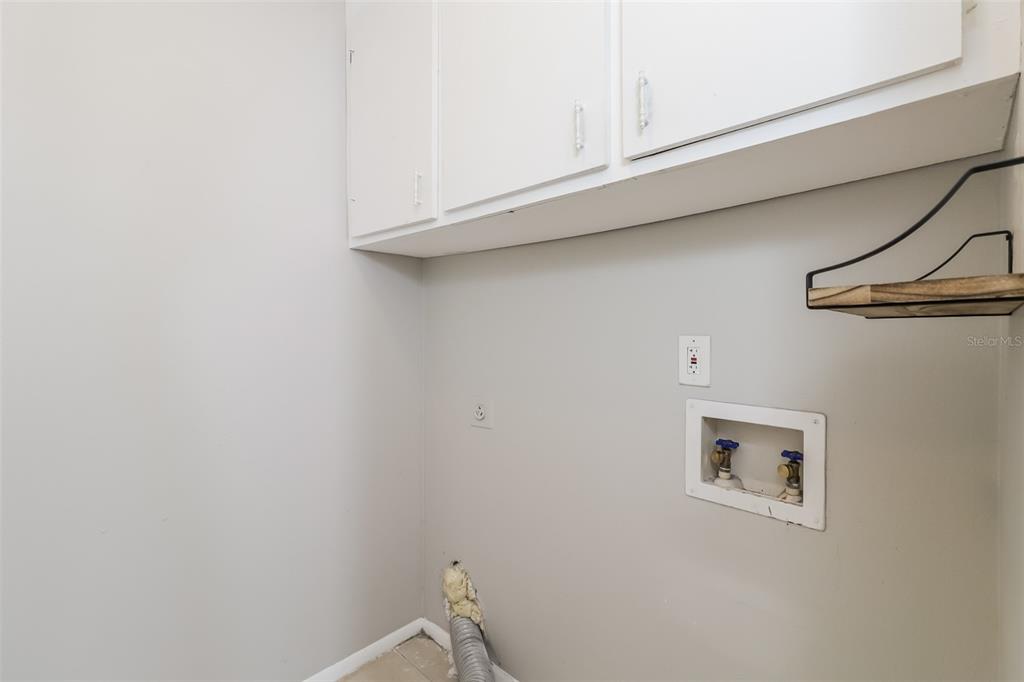 12125 Shadow Ridge Boulevard Hudson, FL 34669 - Photo 9 of 21 a bathroom with a sink