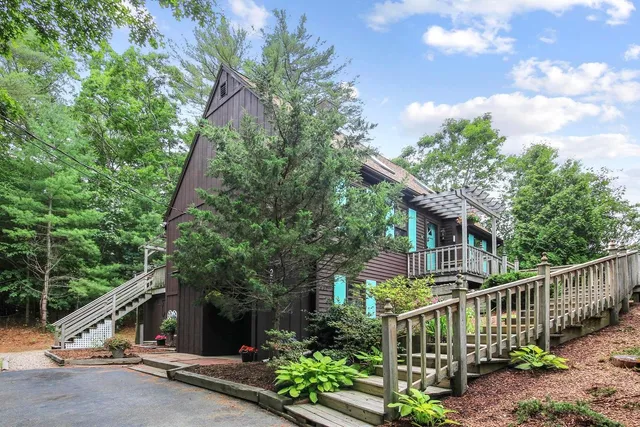 a view of a house with a street