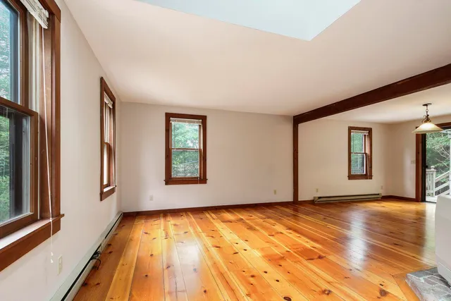 a view of an empty room with glass door