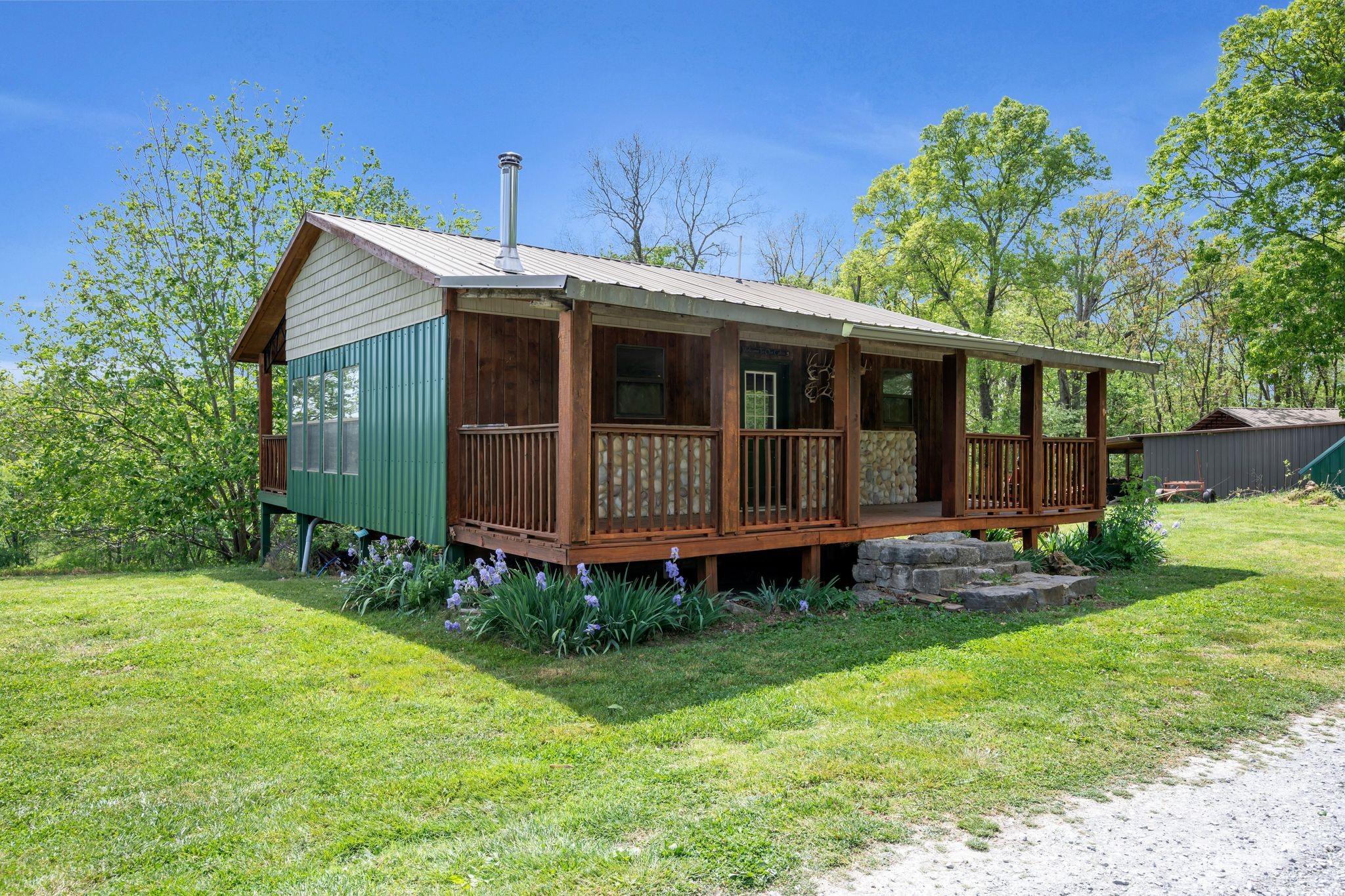 39 Fayetteville Road Kelso, TN 37348 - Photo 49 of 75 a view of a house with a yard and plants