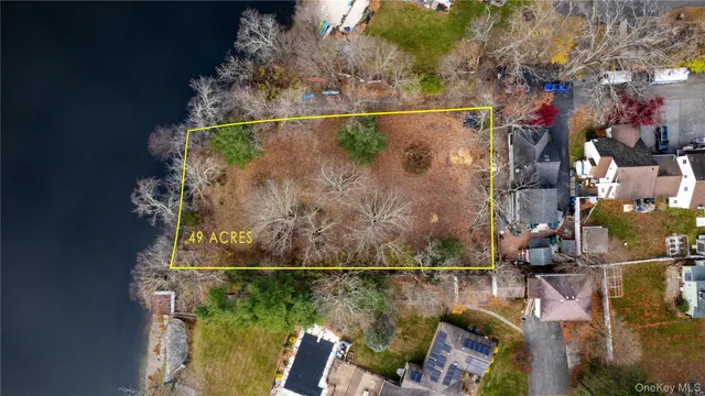an aerial view of a house with a lake view