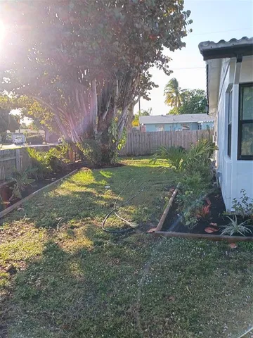 a view of a backyard with pathway