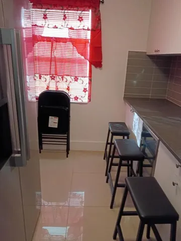 a view of a chairs and a table in a room
