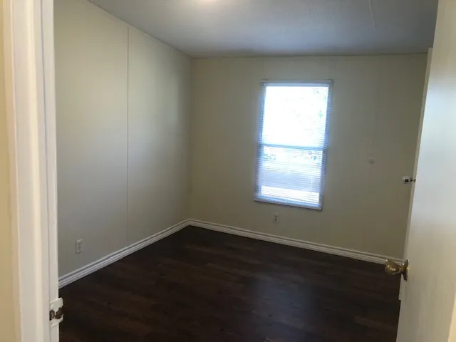a bathroom with a toilet and bathtub