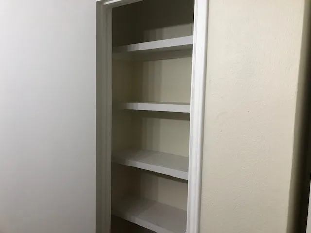 a bathroom with a glass shower door