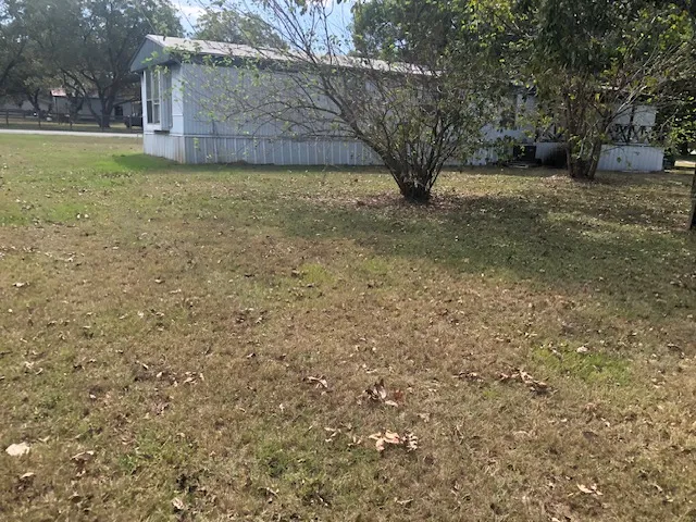 a view of backyard with deck