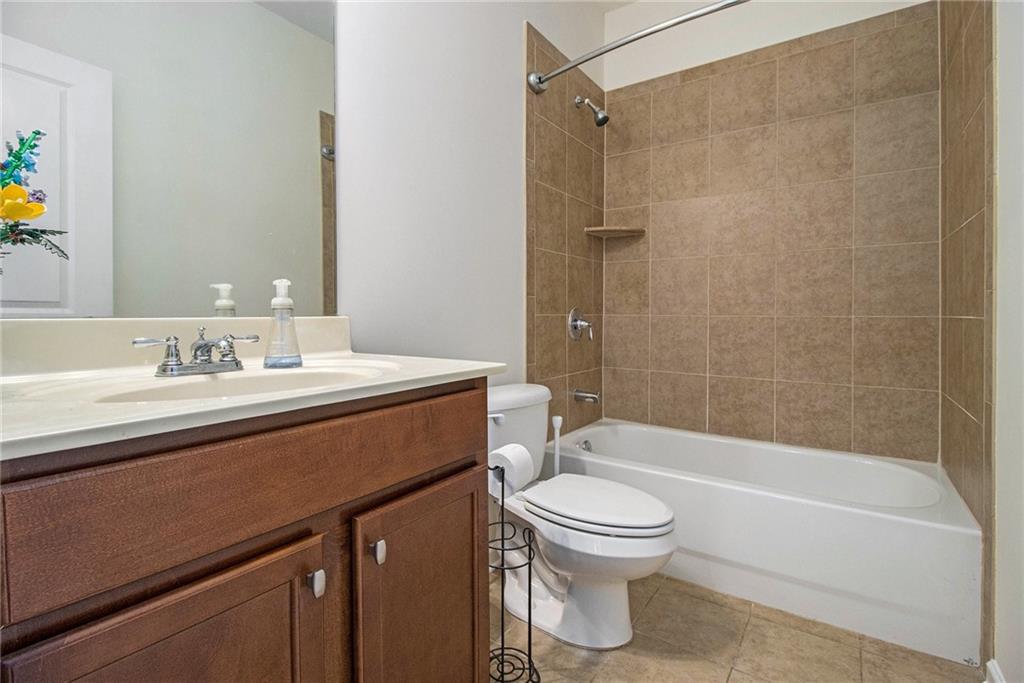218 Third Avenue Avondale Estates, GA 30002 - Photo 5 of 26 a bathroom with a sink a toilet and a bathtub
