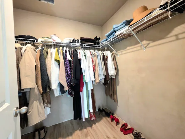 a white toilet sitting next to a small bathroom