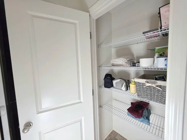 a view of a hallway with a wooden floor