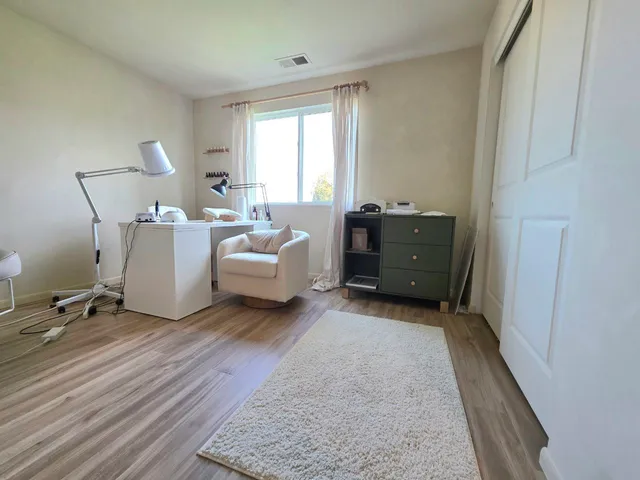 a view of livingroom with washer and dryer