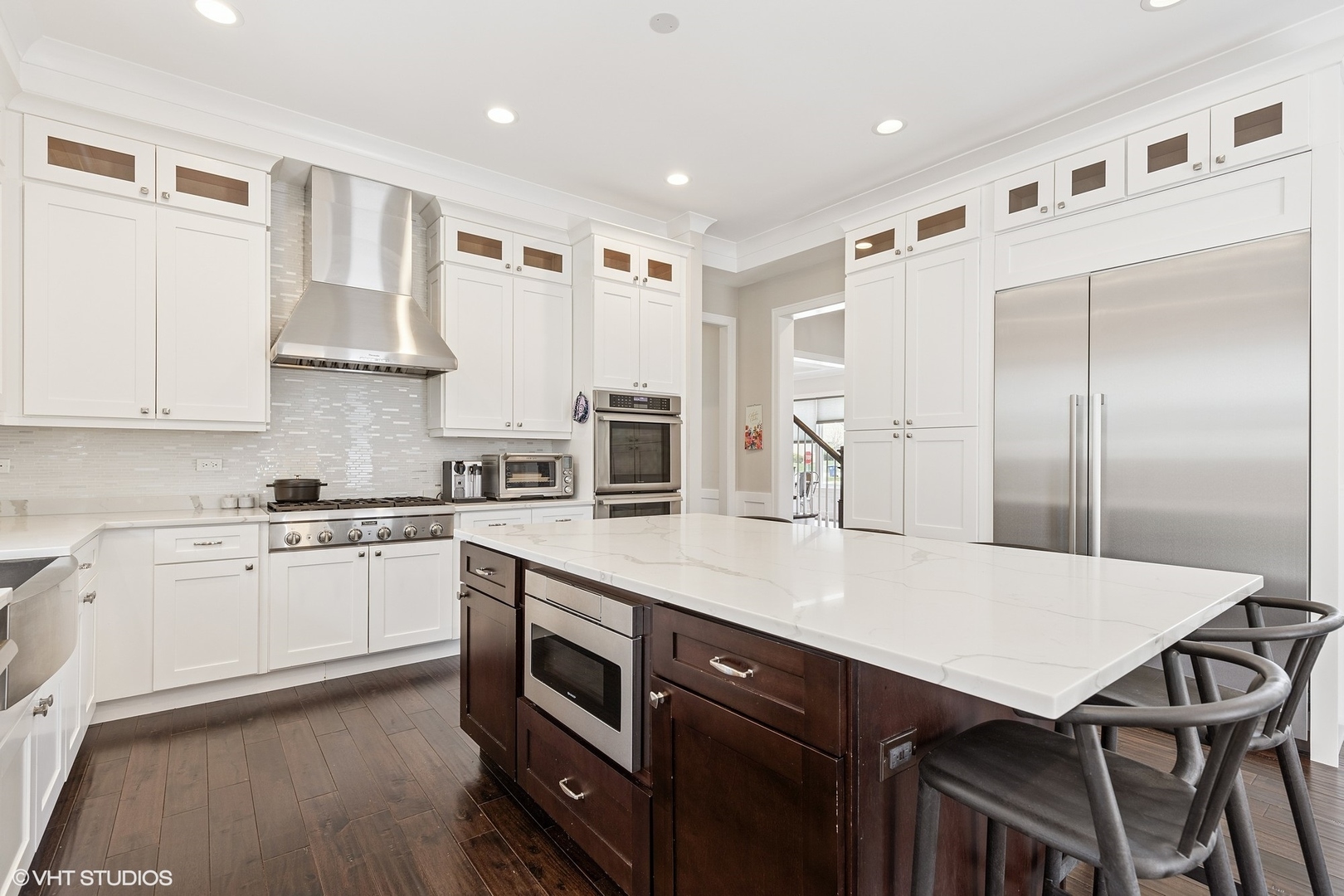 2131 Parkview Court Wilmette, IL 60091 - Photo 12 of 54 a kitchen with a table chairs refrigerator and cabinets