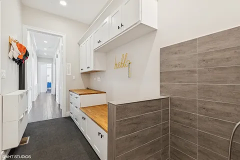 a bathroom with a tub a sink and a shower