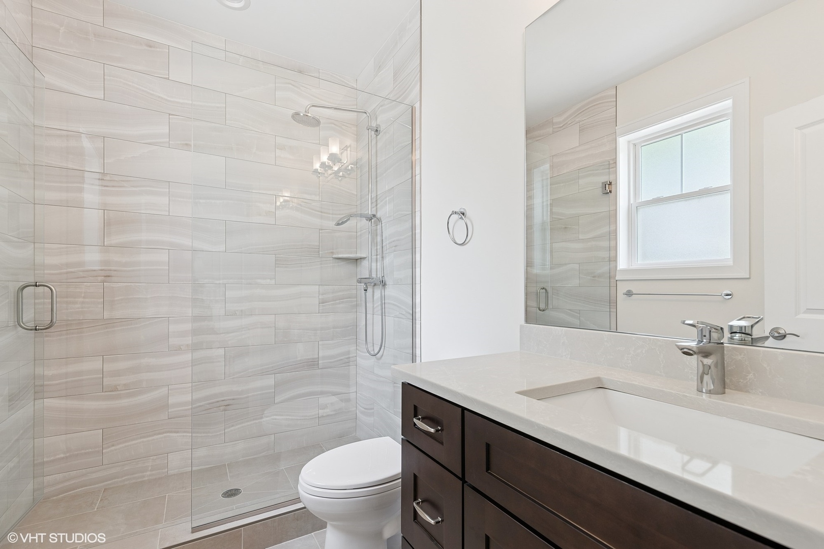 2131 Parkview Court Wilmette, IL 60091 - Photo 30 of 54 a bathroom with a sink a toilet and shower