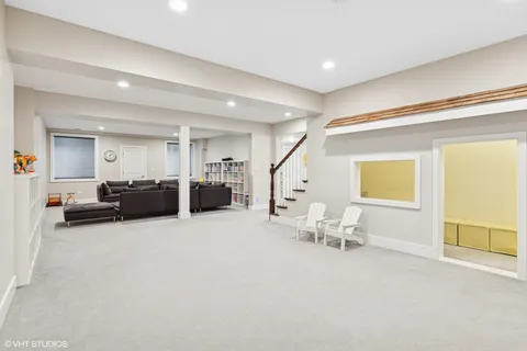 a spacious bedroom with a bed and a dresser