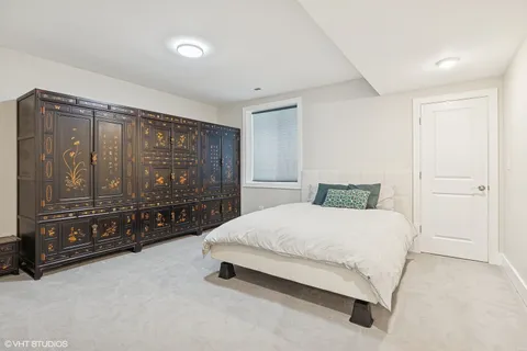 a view of a dining room with furniture and a window
