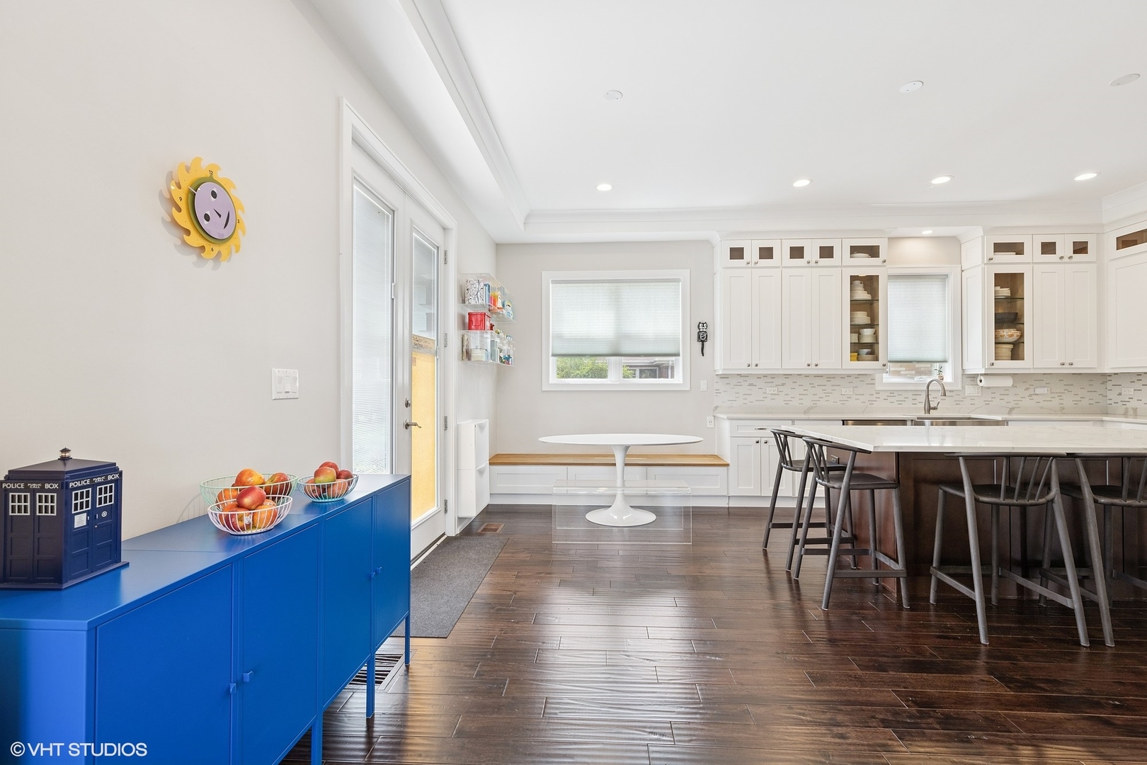 2131 Parkview Court Wilmette, IL 60091 - Photo 10 of 54 a kitchen with granite countertop a stove a refrigerator a dining table and chairs with wooden floor