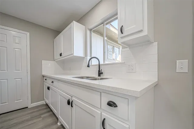 a view with a sink and cabinets