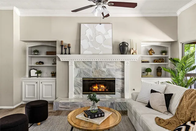 a living room with furniture and a fireplace