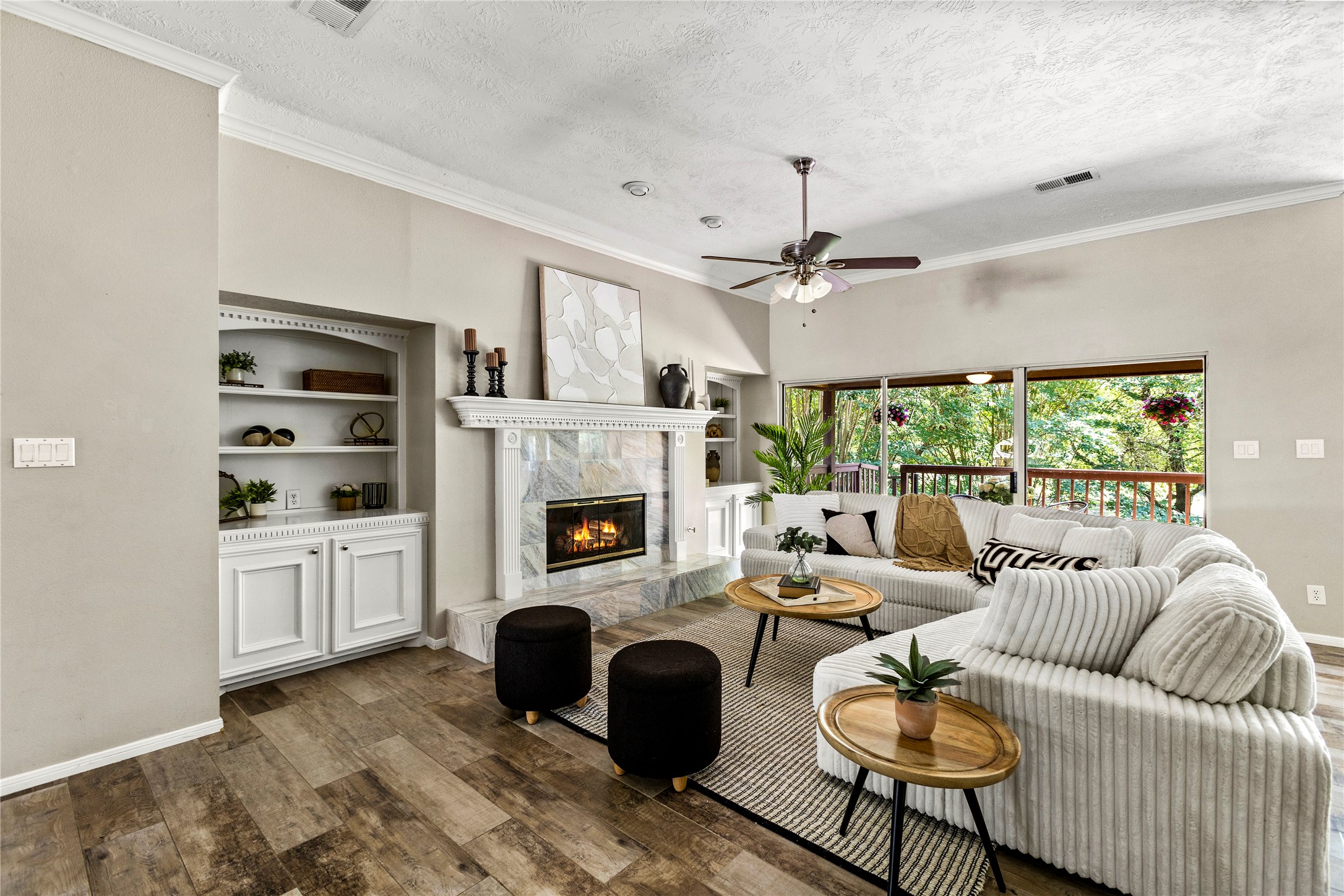 170 April Cove Conroe, TX 77356 - Photo 13 of 50 a living room with furniture fireplace and a large window