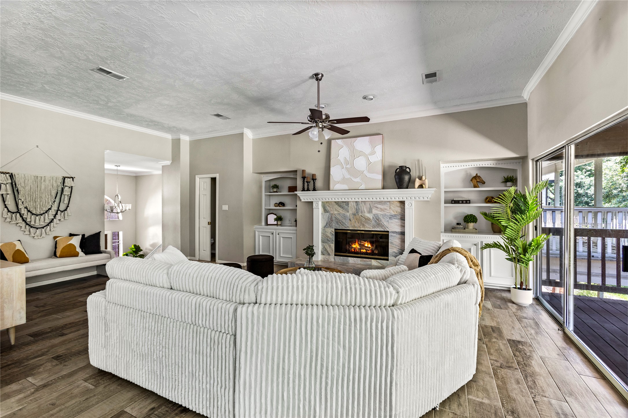170 April Cove Conroe, TX 77356 - Photo 14 of 50 a living room with furniture a fireplace and a table