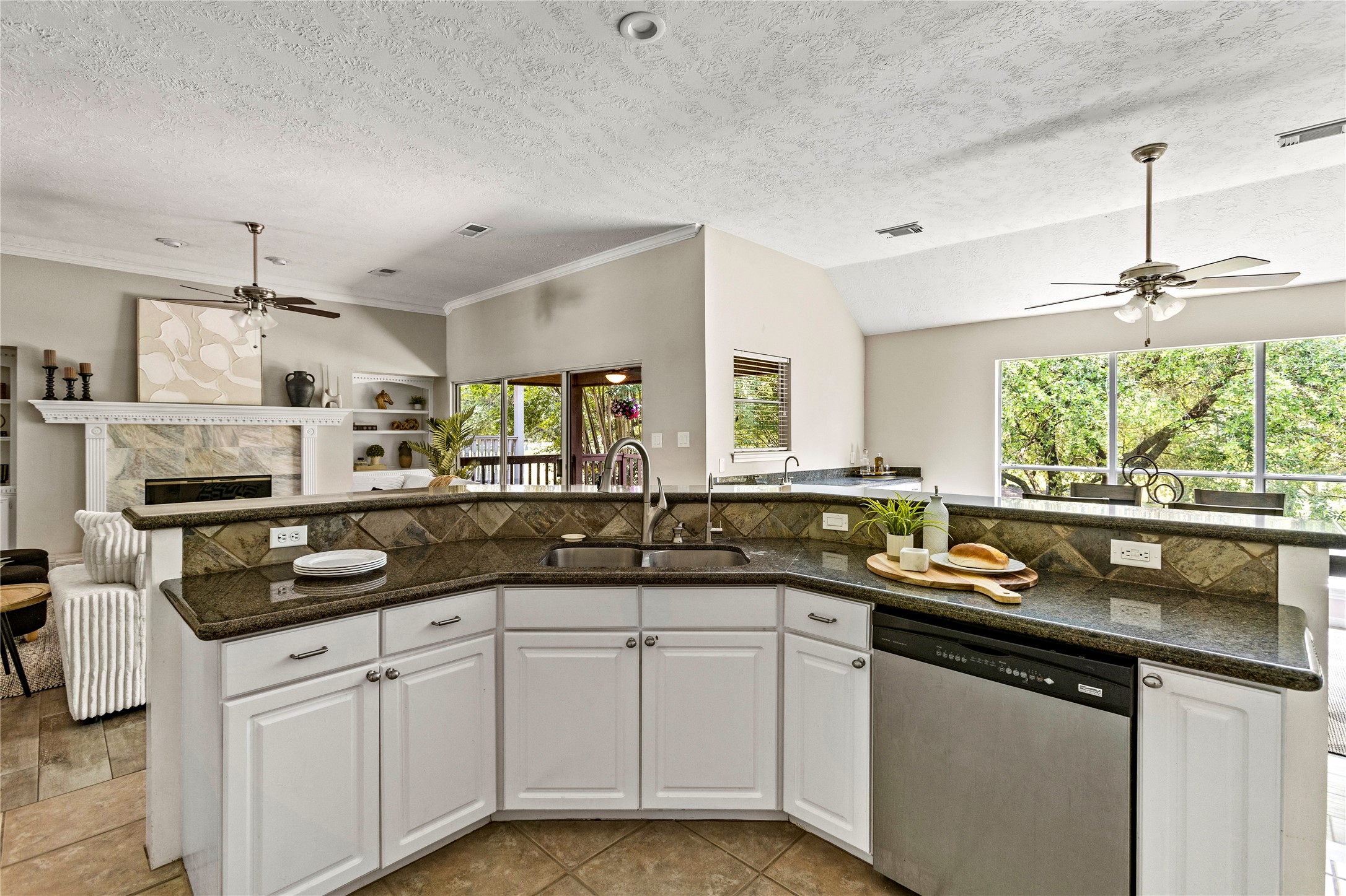 170 April Cove Conroe, TX 77356 - Photo 18 of 50 a kitchen with a sink stove and cabinets