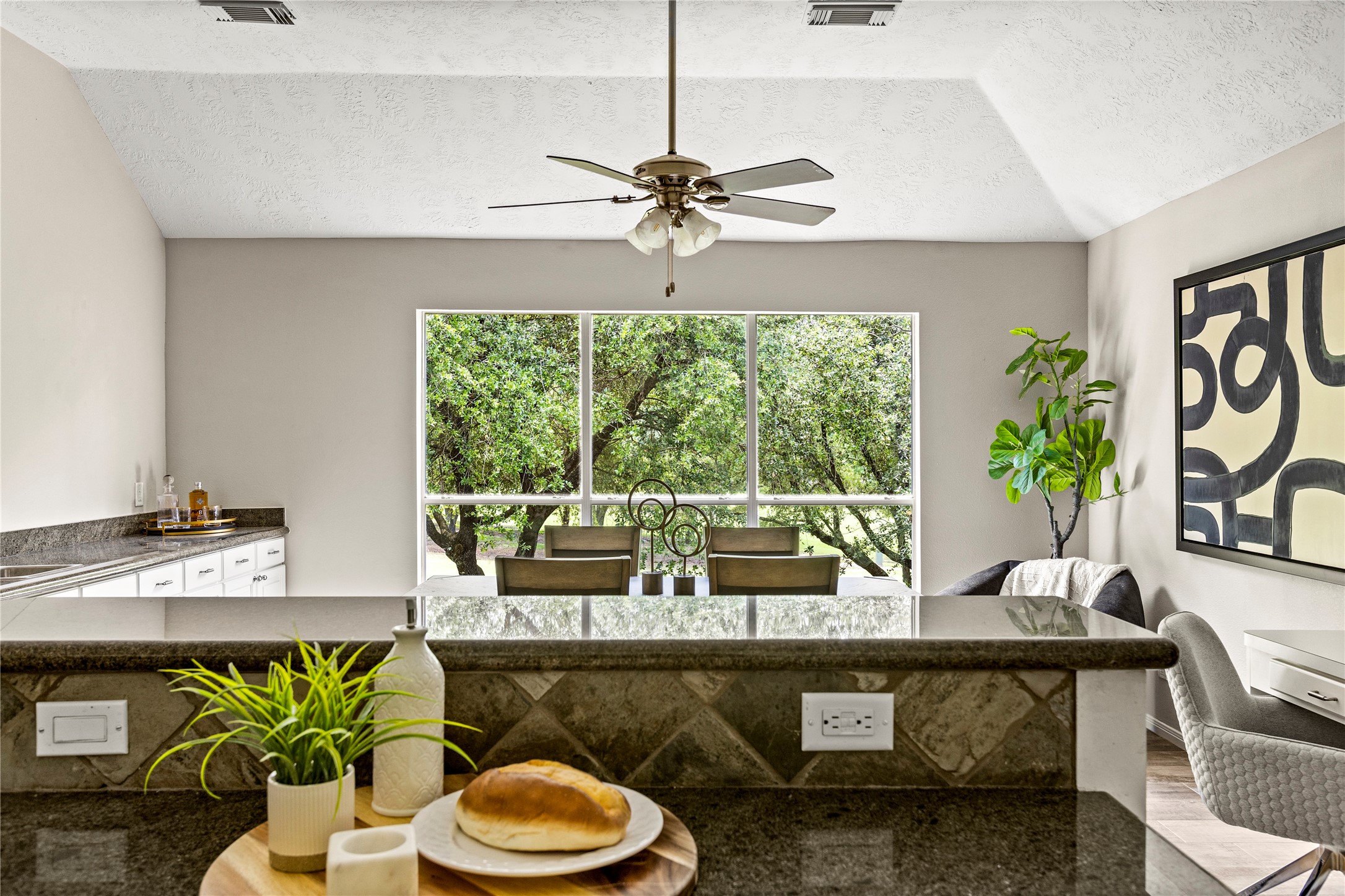170 April Cove Conroe, TX 77356 - Photo 20 of 50 a living room with a couch and a potted plant