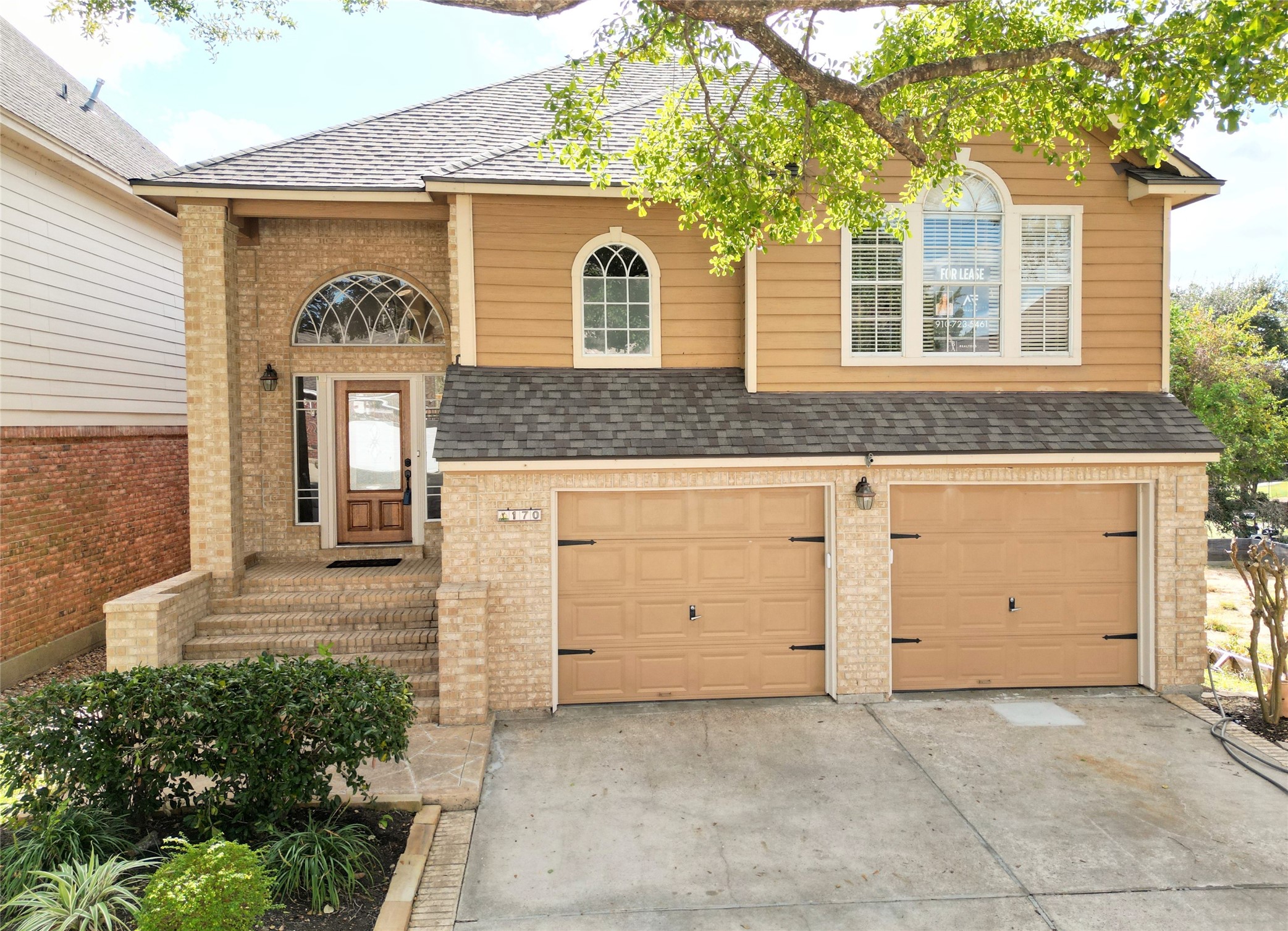 170 April Cove Conroe, TX 77356 - Photo 2 of 50 a front view of a house with a yard