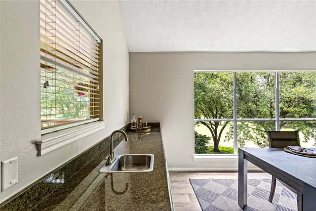 a kitchen with a sink and a window