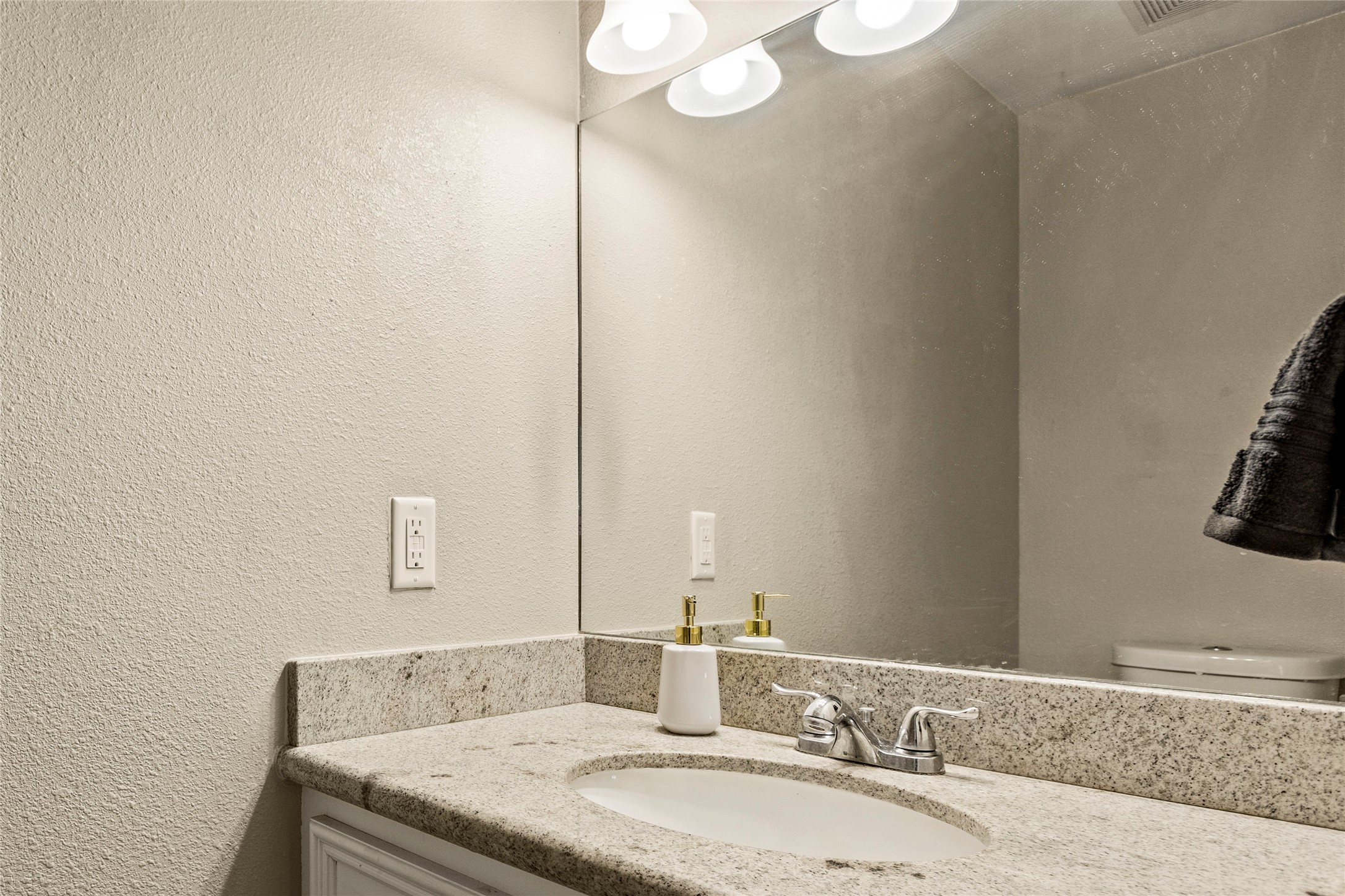 170 April Cove Conroe, TX 77356 - Photo 23 of 50 a bathroom with a granite countertop sink and a mirror