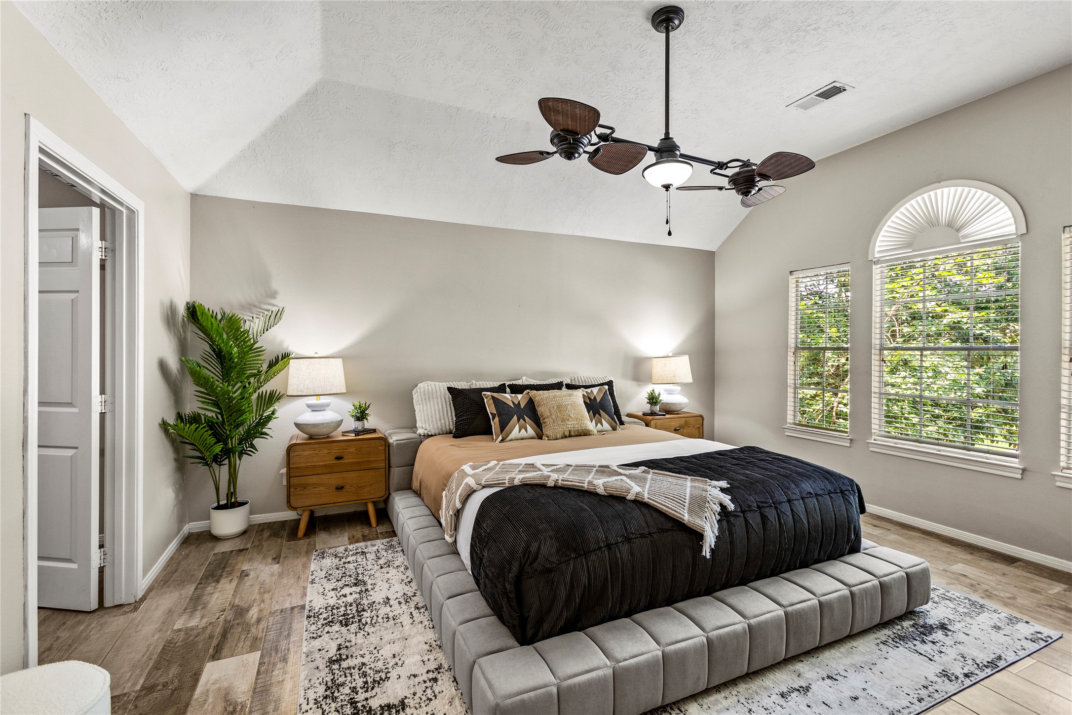 170 April Cove Conroe, TX 77356 - Photo 29 of 50 a bedroom with a bed ceiling fan and a window