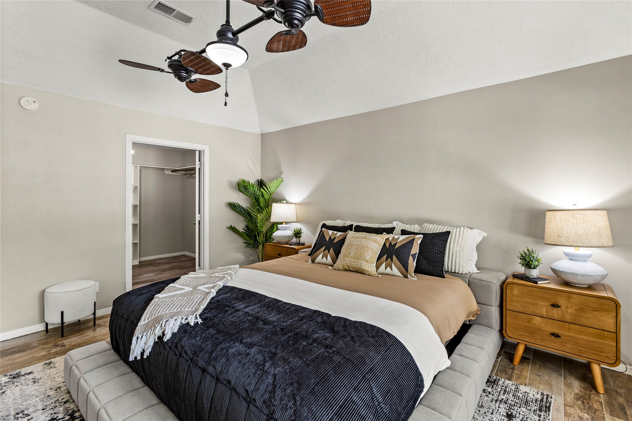 170 April Cove Conroe, TX 77356 - Photo 30 of 50 a bedroom with a bed and ceiling fan