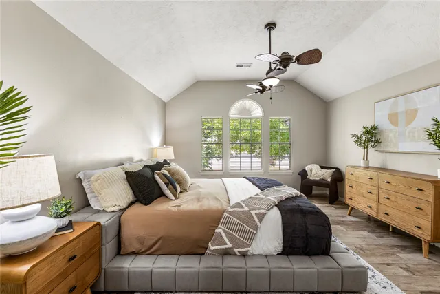 a spacious bathroom with double vanity and a mirror