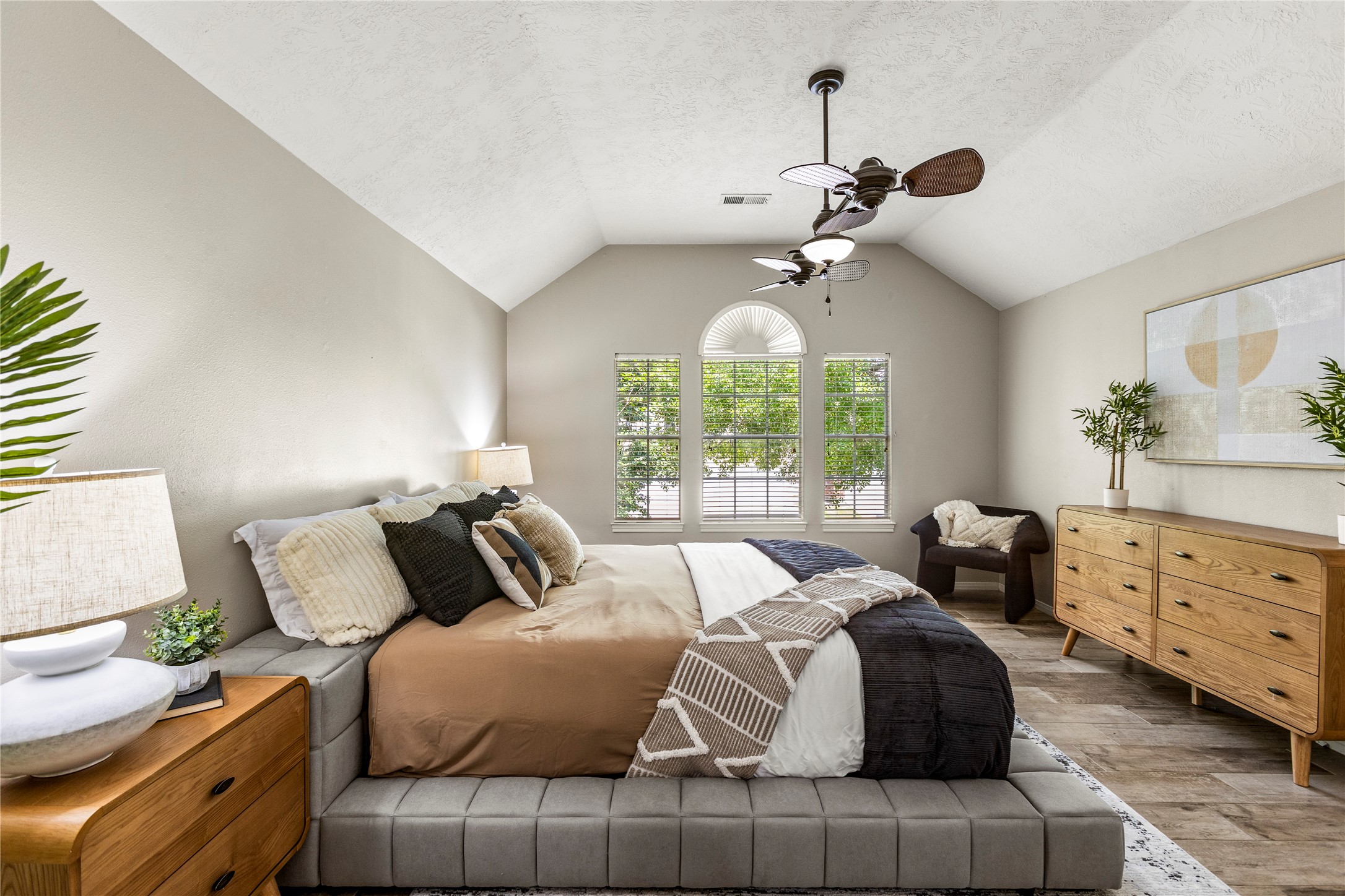 170 April Cove Conroe, TX 77356 - Photo 31 of 50 a bedroom with a bed and a chandelier