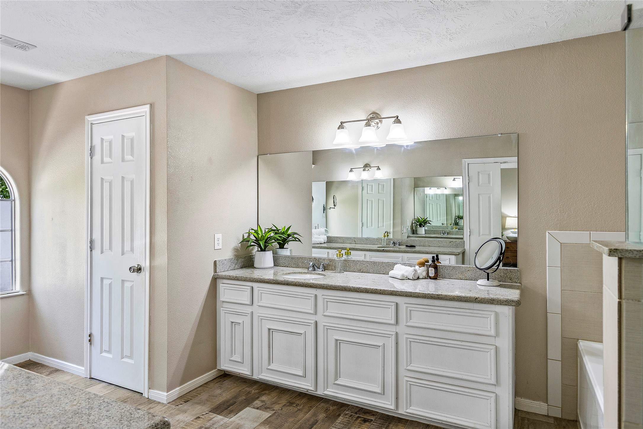 170 April Cove Conroe, TX 77356 - Photo 33 of 50 a bathroom with a sink and a mirror