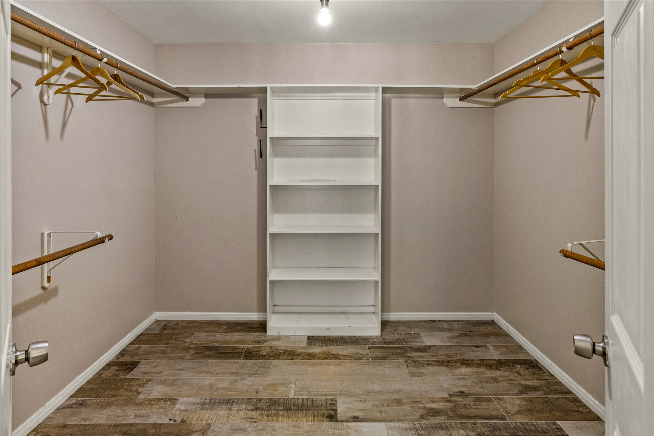 170 April Cove Conroe, TX 77356 - Photo 35 of 50 a view of walk in closet with empty racks