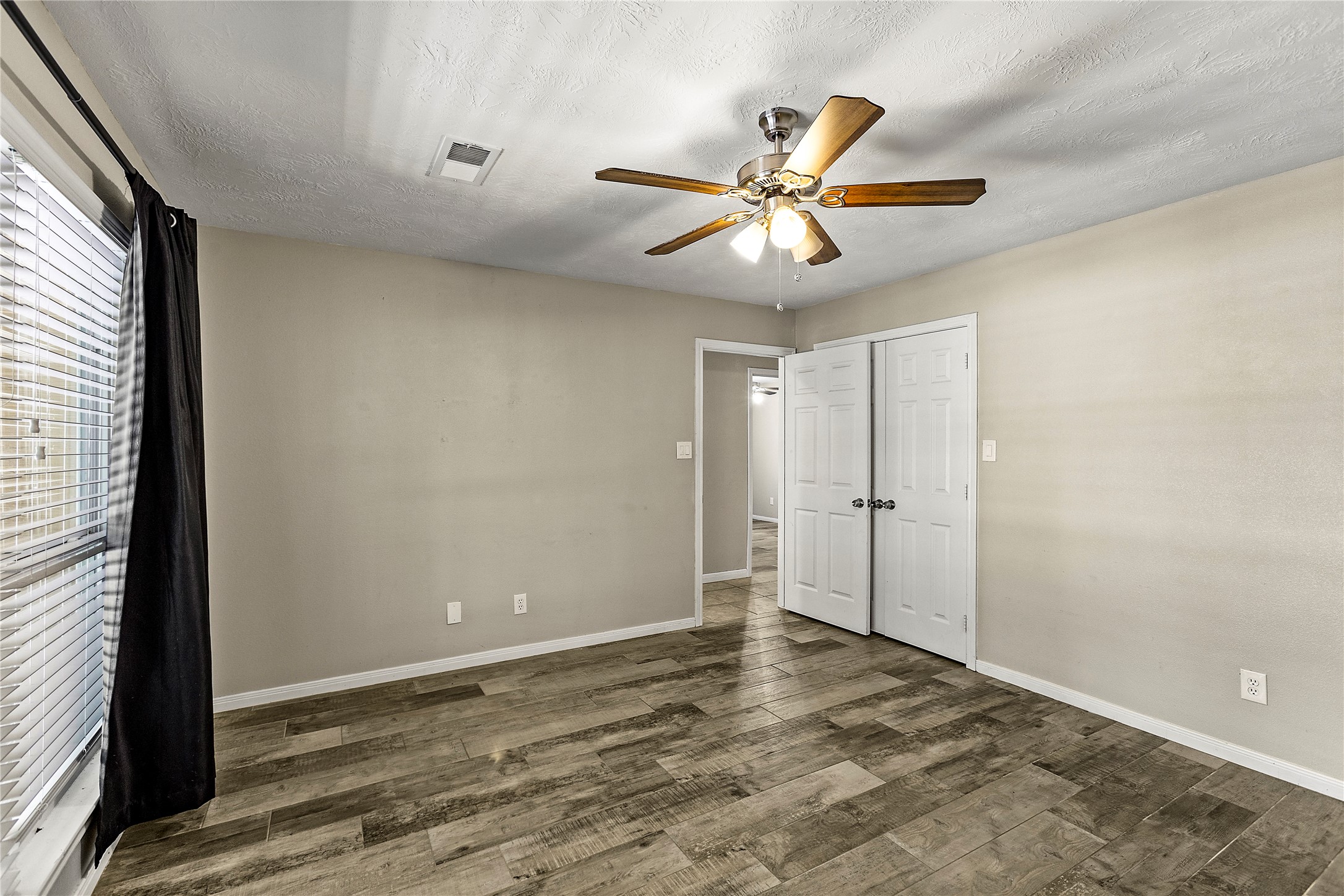 170 April Cove Conroe, TX 77356 - Photo 37 of 50 a view of a livingroom with a ceiling fan and window